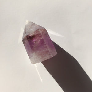 amethyst crystal point with white and purple details